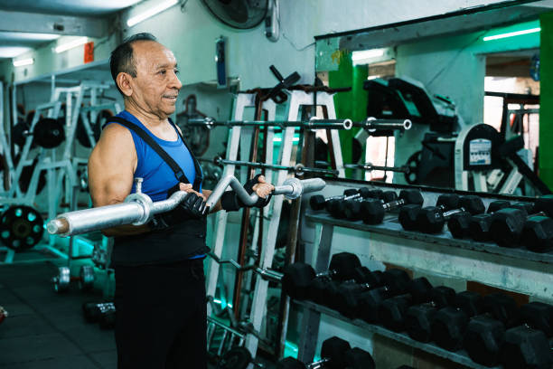 Elderly person exercising in gym