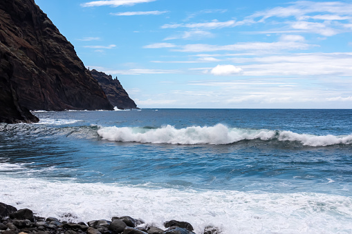 Scenic view on pebble beach Playa del Tamadite in Anaga mountains, Tenerife, Canary Islands, Spain, Europe. Panoramic coastal hiking trail from Afur to Taganana. Waves from Atlantic Ocean. Seascape