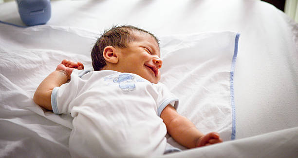 istock Newborn baby sleeping and smile 184181432