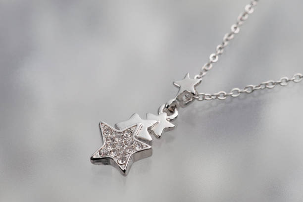 istock Stylish star-shaped necklace decorated with diamonds 1841906896