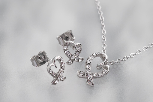 Necklace and earrings with a diamond heartHeart necklace and earrings with diamonds