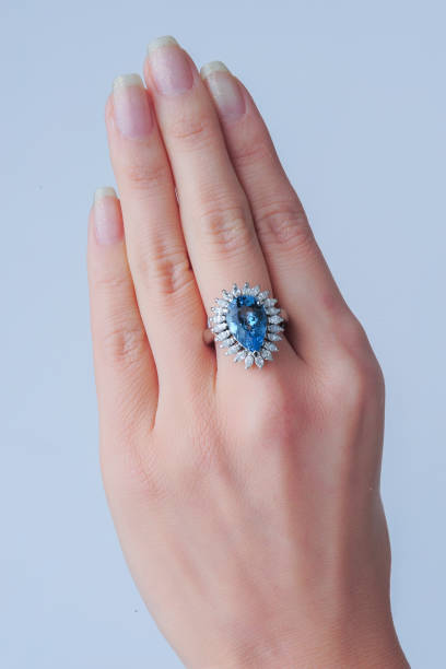 istock Hand with a beautiful green sapphire ring 1841911653