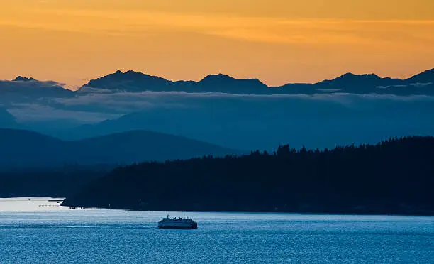 Photo of Seattle Ferry and the Olympic Mountains.