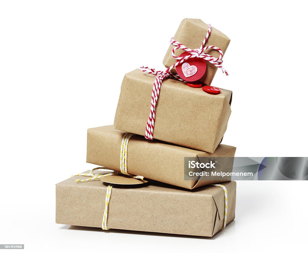 Stack of gift boxes on white background Stack of handcraft gift boxes on white background Christmas Present Stock Photo