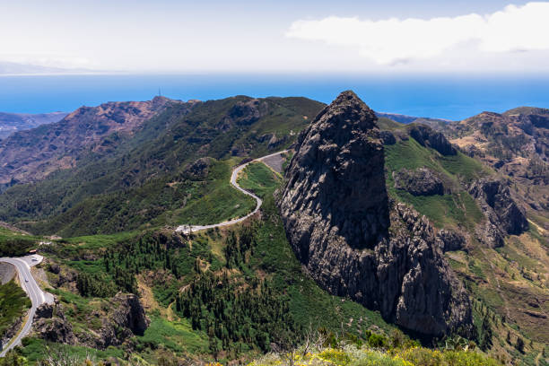 istock Roque Agando - Scenic mountain road with view on massive volcanic rock formation Roque de Agando on La Gomera, Spain 1841946762