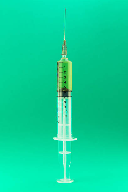 istock Syringe with a medicine, focus on needle tip 184196917