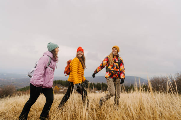 istock Smiling friends hiking together 1841982471