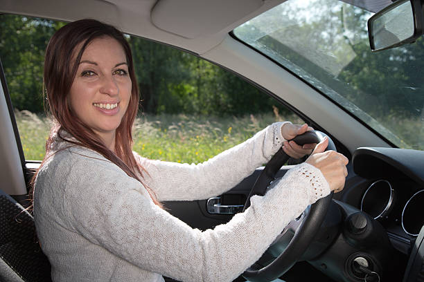 istock Happy woman driving a car 184199111