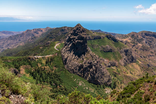 istock Roque Agando - Scenic mountain road with view on massive volcanic rock formation Roque de Agando on La Gomera, Spain 1841998703