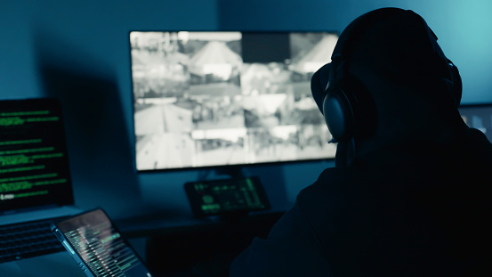 Computer Hacking Van Back A Dangerous Hacker Wearing Headphones Using Computer Attack On ...