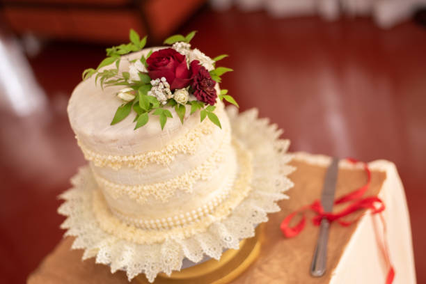 istock Beautiful wedding cake with red roses 1842037041
