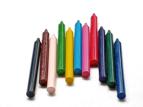 colorful old oil crayons for coloring on a white background