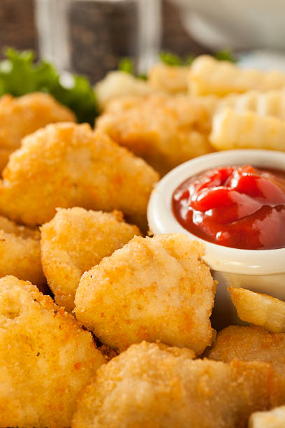 istock Unhealthy Chicken Nuggets and Fries 184205568
