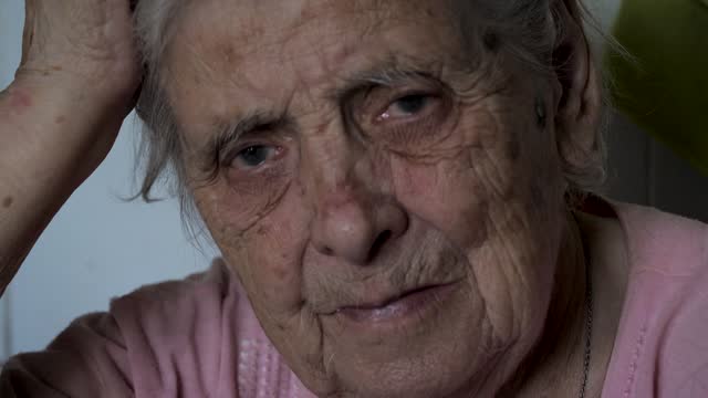 Portrait Of Very Elderly Old Woman With Deep Wrinkles Gray Hair In Nursing Homes