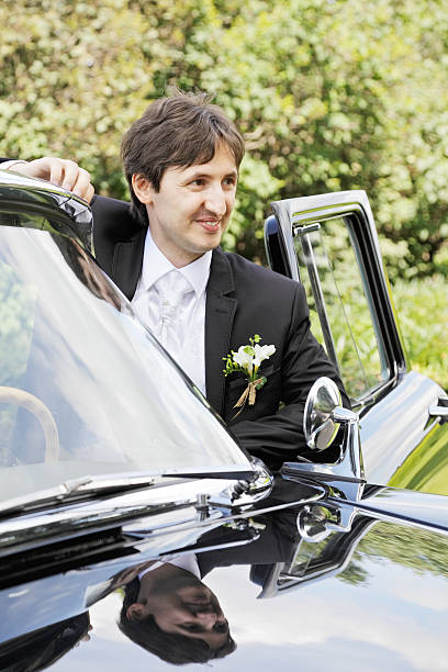 istock Smiling groom at car 184209731