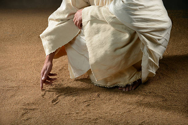 Jesus Writting in the Sand stock photo