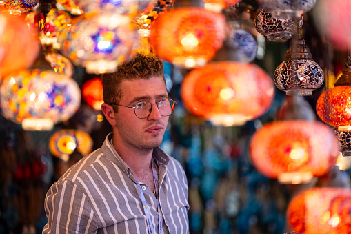 Faridabad, Haryana, India - February 2023:  Foreigner vendors participating in surajkund craft fair to sell their products. Surajkund is a international craft fair where people come and sale and buy craft products.