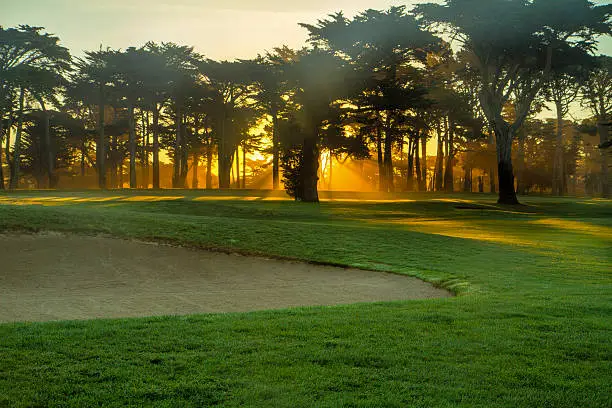 Photo of Sunrise in misty galf course