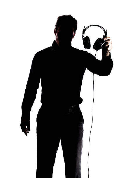 istock Male in silhouette showing headphones 184213220