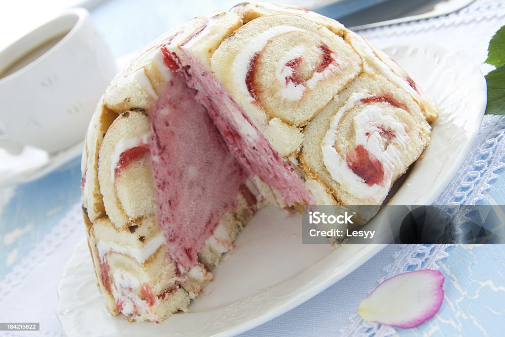 Cake "Charlotte royale" with ice cream and Swiss rolls. Baked Stock Photo