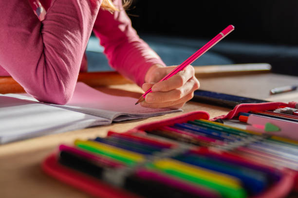 istock Close up of a girl doing her homework 1842168273