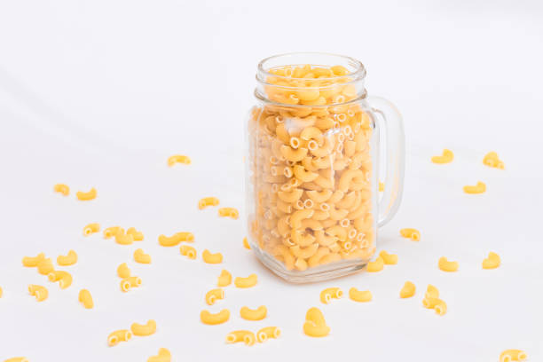 istock Uncooked Chifferi Rigati Pasta in Glass Jar on White Background 1842197481