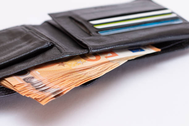 istock Opened Black Leather Men Wallet with Euro Banknotes Inside on White Background 1842205632