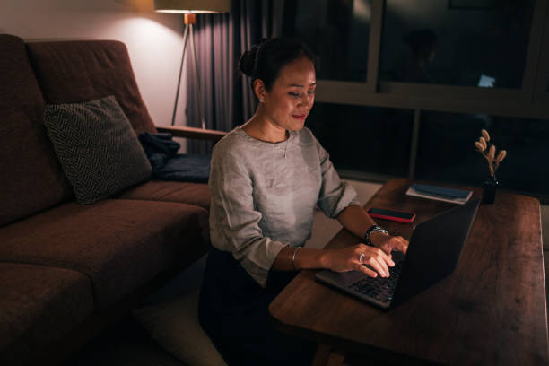 istock A Happy Beautiful Businesswoman Working From Home On Her Computer At Night 1842212024