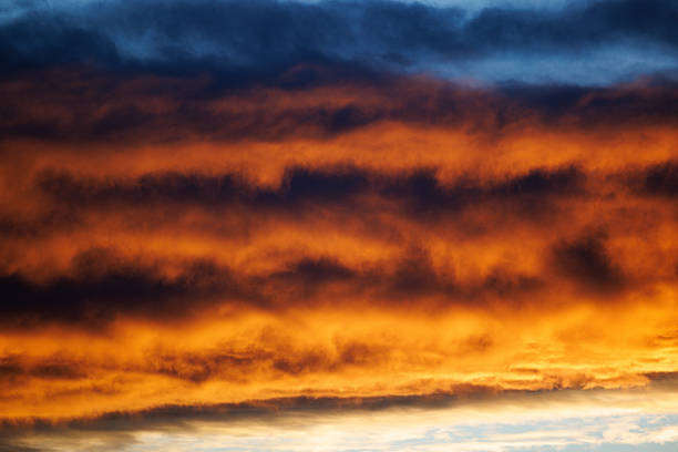 Beautiful and foreboding clouds lit by the golden and coppery hues of sunset uniquely presented as only Colorado USA can do.