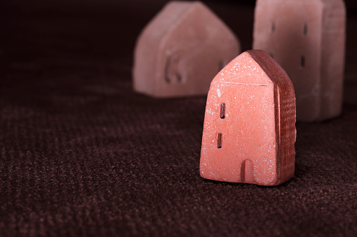 Stone miniature building model. Red concrete sculpture house artwork architecture model casting modern art.