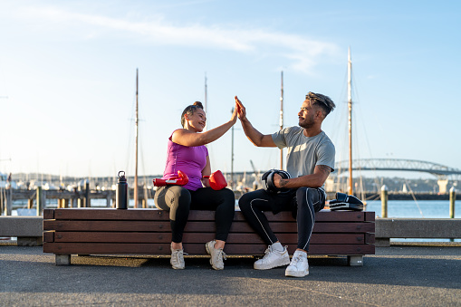 couple giving high five after intense workout