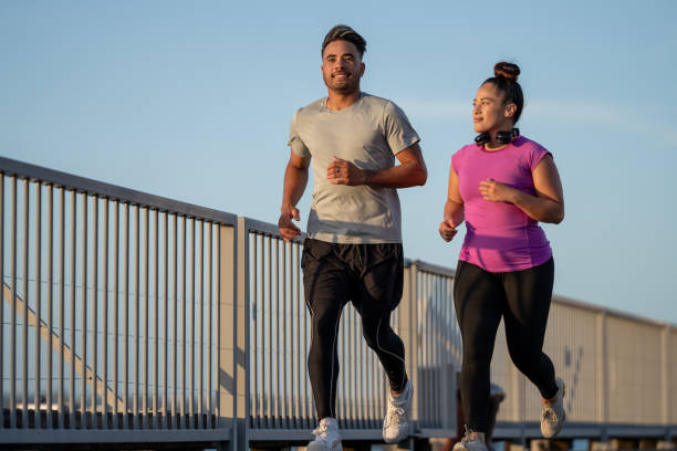 istock young man and woman running 1842243534
