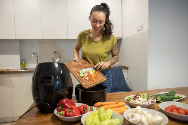 istock Happy girl making veggie meal 1842261952