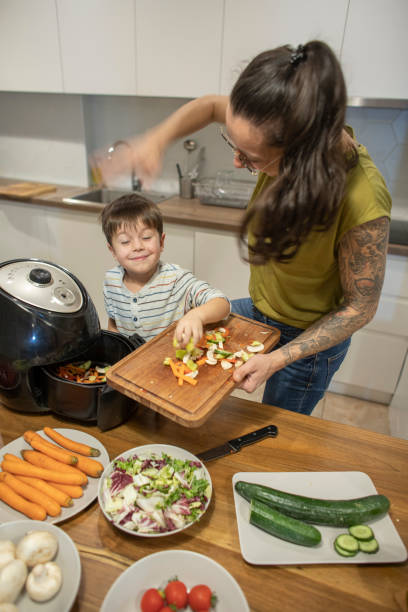 istock Cute boy having fun cooking with mom 1842261962