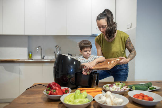 istock Four years old boy cooking with mom 1842261972