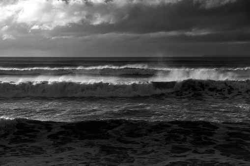An Atlantic storm pushes large waves onto a Devon beach, UK