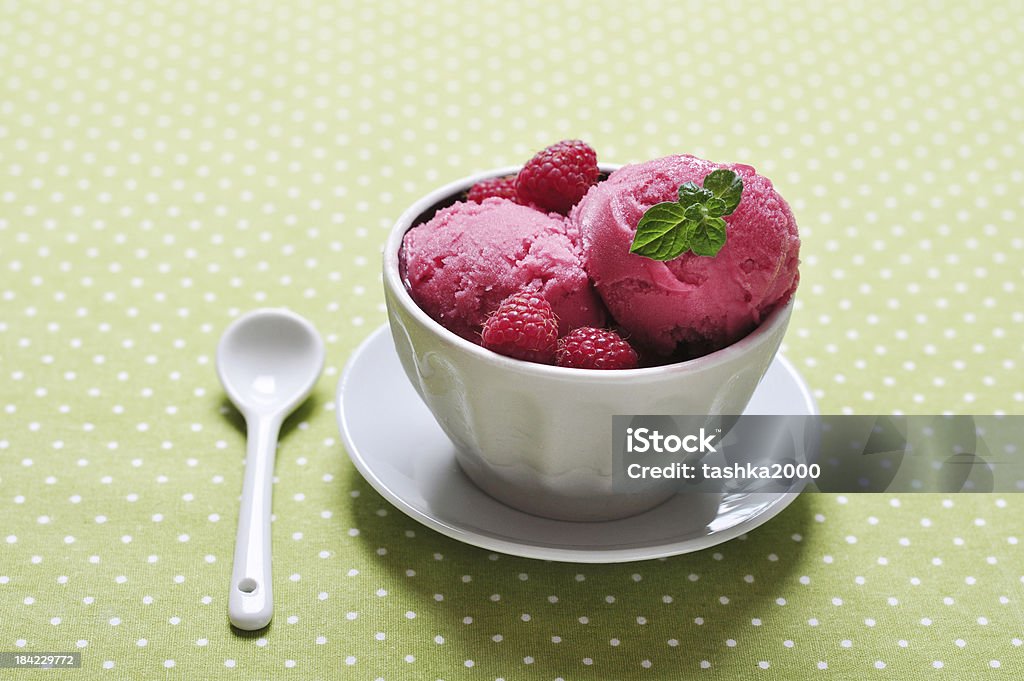 Raspberry ice cream Raspberry ice cream in ceramic bowl with fresh berries and mint Backgrounds Stock Photo