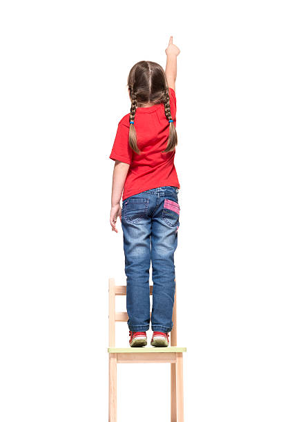 istock little girl pointing to something up high 184230290