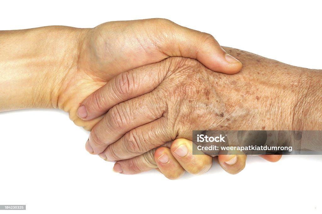 Old and young holding hands A Helping Hand Stock Photo