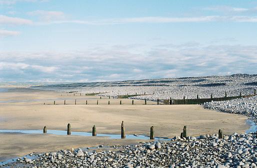 Westward Ho! beach on a sunny day, with Sauton Sands in the distance, 35mm film.