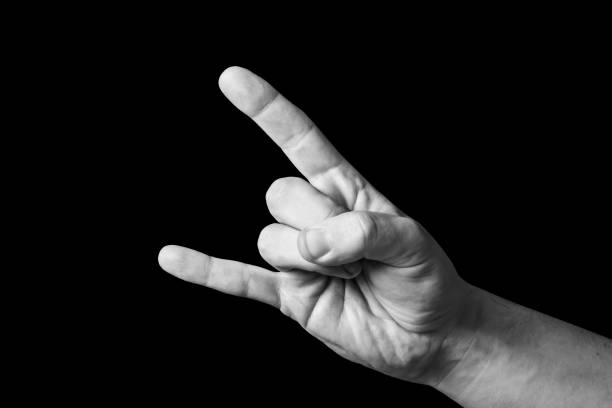istock Hardcore hand gesture. Rock and roll music symbol. Hand isolated on black. 1842323698