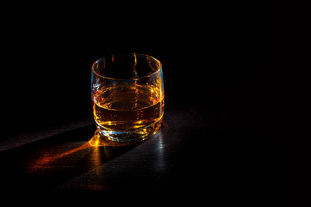 Whiskey in a glass stock photo