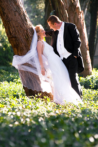 istock Young romantic couple romantically flirting under a tree 184232824