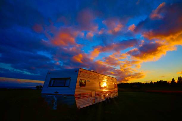 camping trailer caravan with colorful sky and sunset