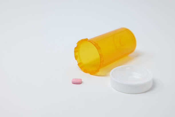 istock Pill and medicine bottle on white background with medication 1842331754