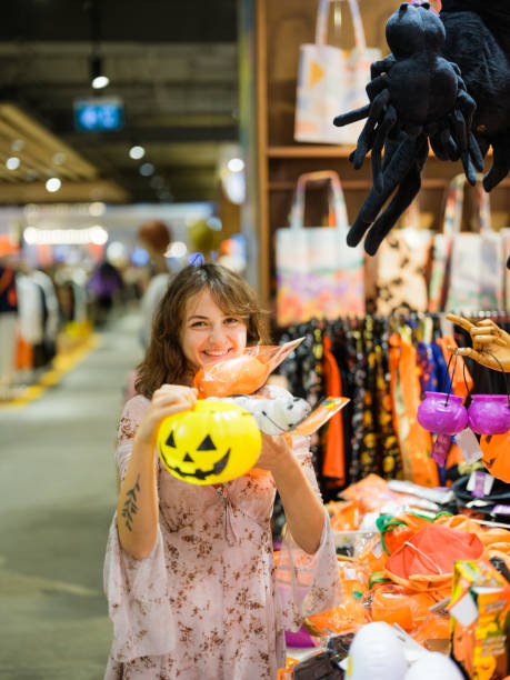 istock Cheerful woman shopping for  Halloween 1842365062