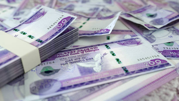 istock close up of Ethiopian birr notes spread on table. 3d rendering of money scattered on surface 1842407167