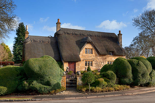 Cotswold thatched cottage Beautiful Cotswold, honey-coloured, thatched cottage, Chipping Campden, Gloucestershire, England. gloucestershire stock pictures, royalty-free photos & images