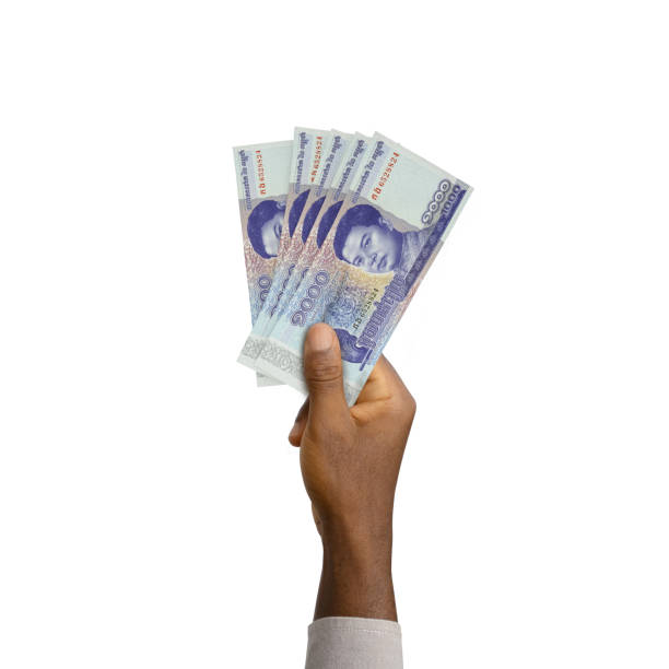 istock Black Hand holding 3D rendered 1000 Cambodian riel notes isolated on white background 1842423514