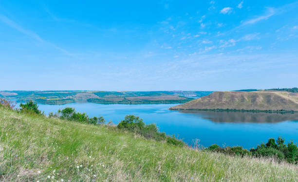 istock summer landscape green hills and river idyllic day time panoramic photo 1842459417